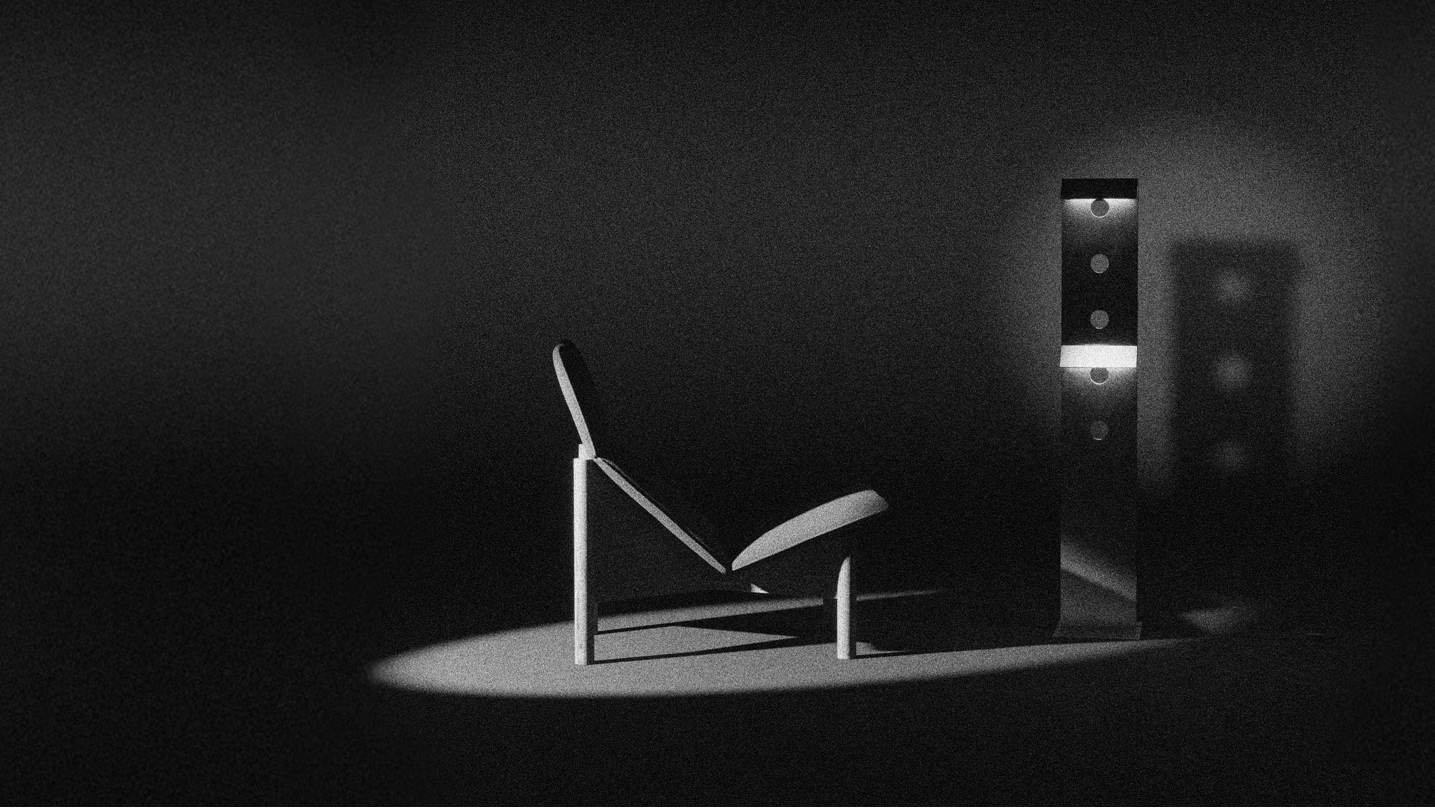 Modern chair in a dark room with a spotlight on it